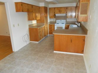 Installed new sheet vinyl flooring and new plastic laminate countertops.